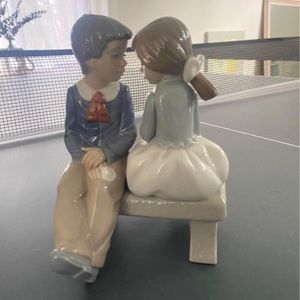 Lladro Nao Boy and girl sitting on the bench figurine